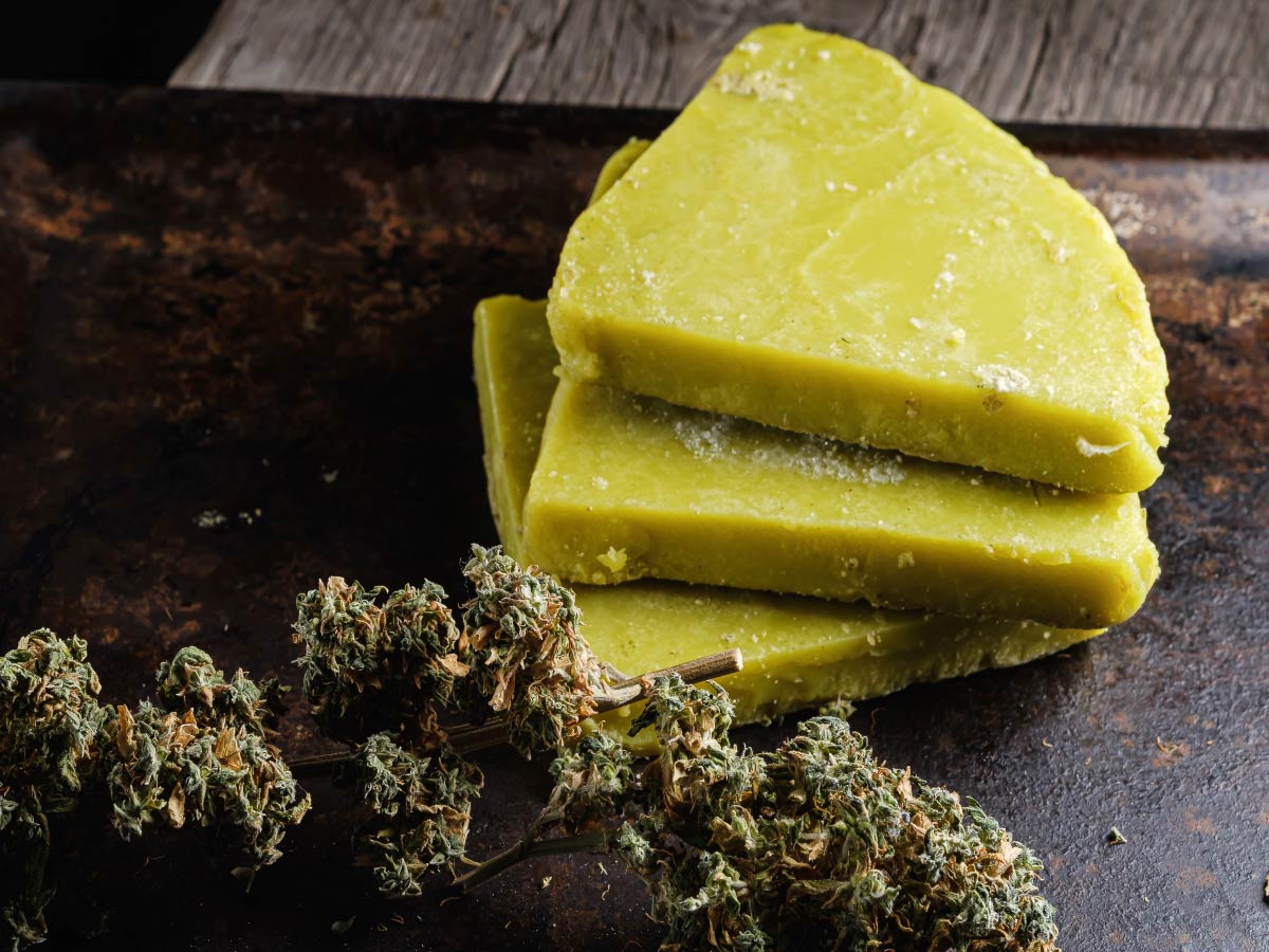 cannabis butter next to cannabis buds