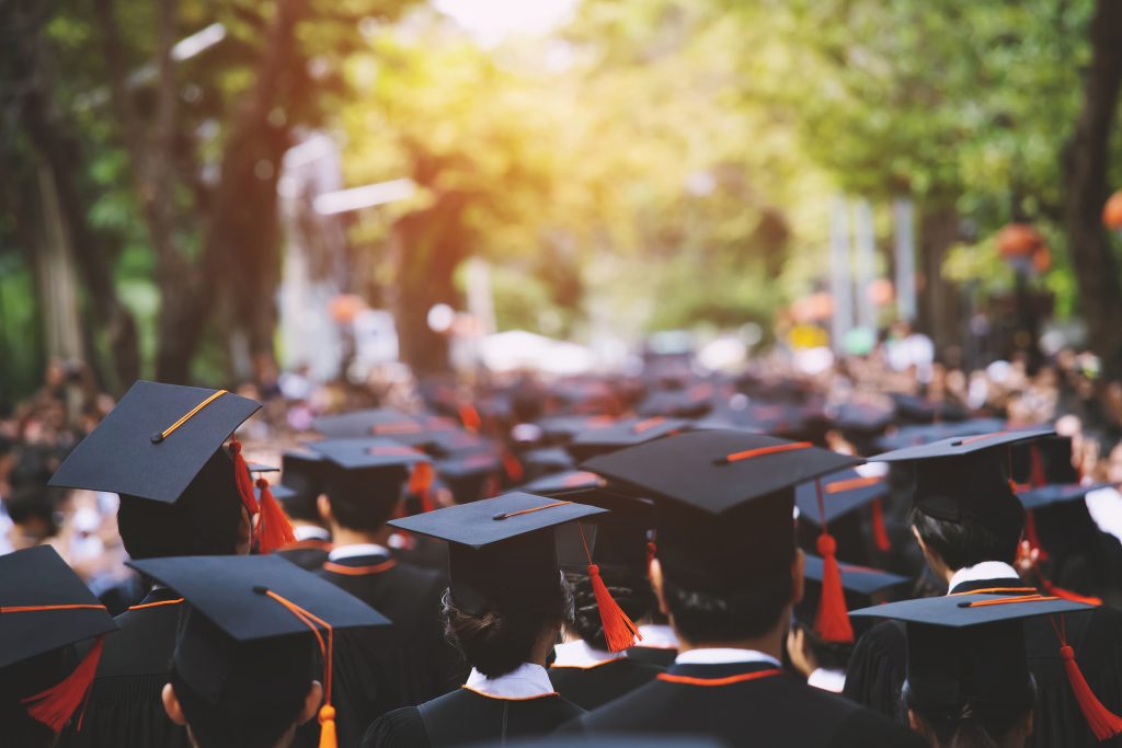 backside graduation hats during commencement success graduates 